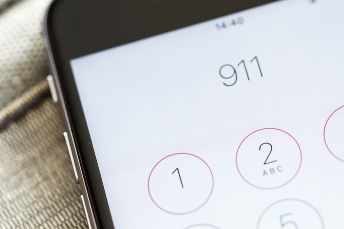 Emergency and urgency, dialing 911 on smartphone screen. Shallow depth of field.