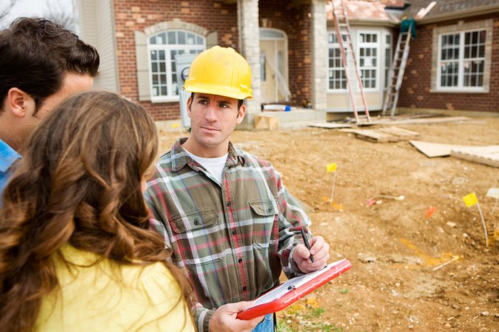 Construction: New Home Construction Site with Builder.
