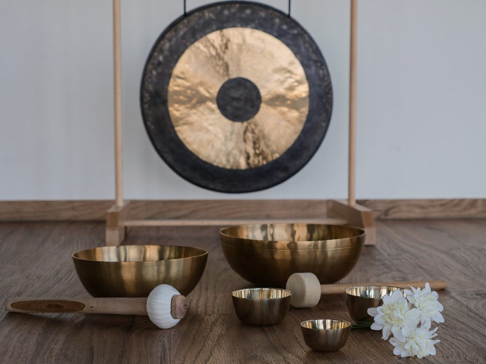 six singing bowls with gong in the background 