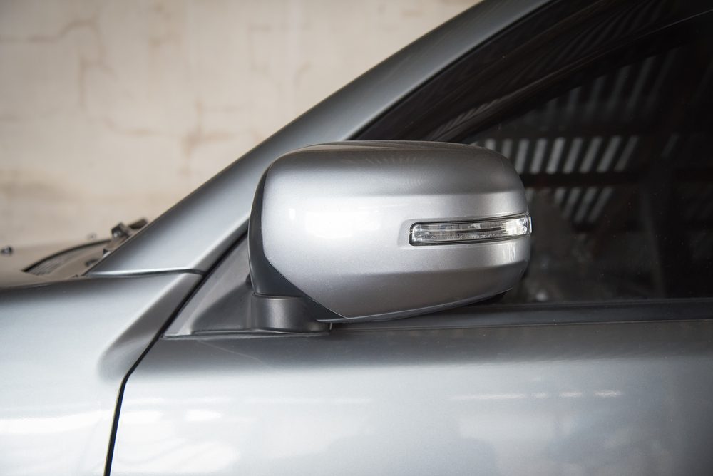 Car mirrors folded in with car fob