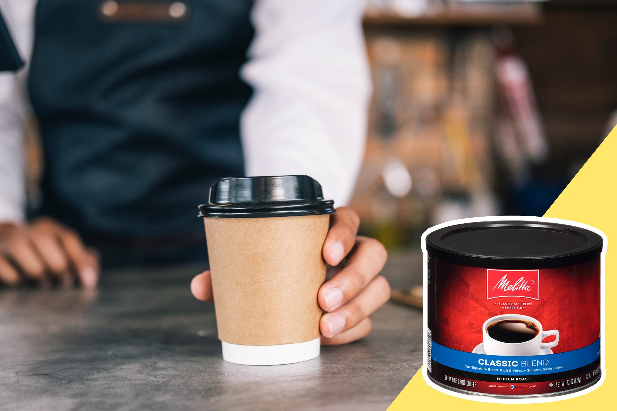 A hand holds a coffee cup on a counter; a Melitta Classic Blend coffee canister is in the foreground.