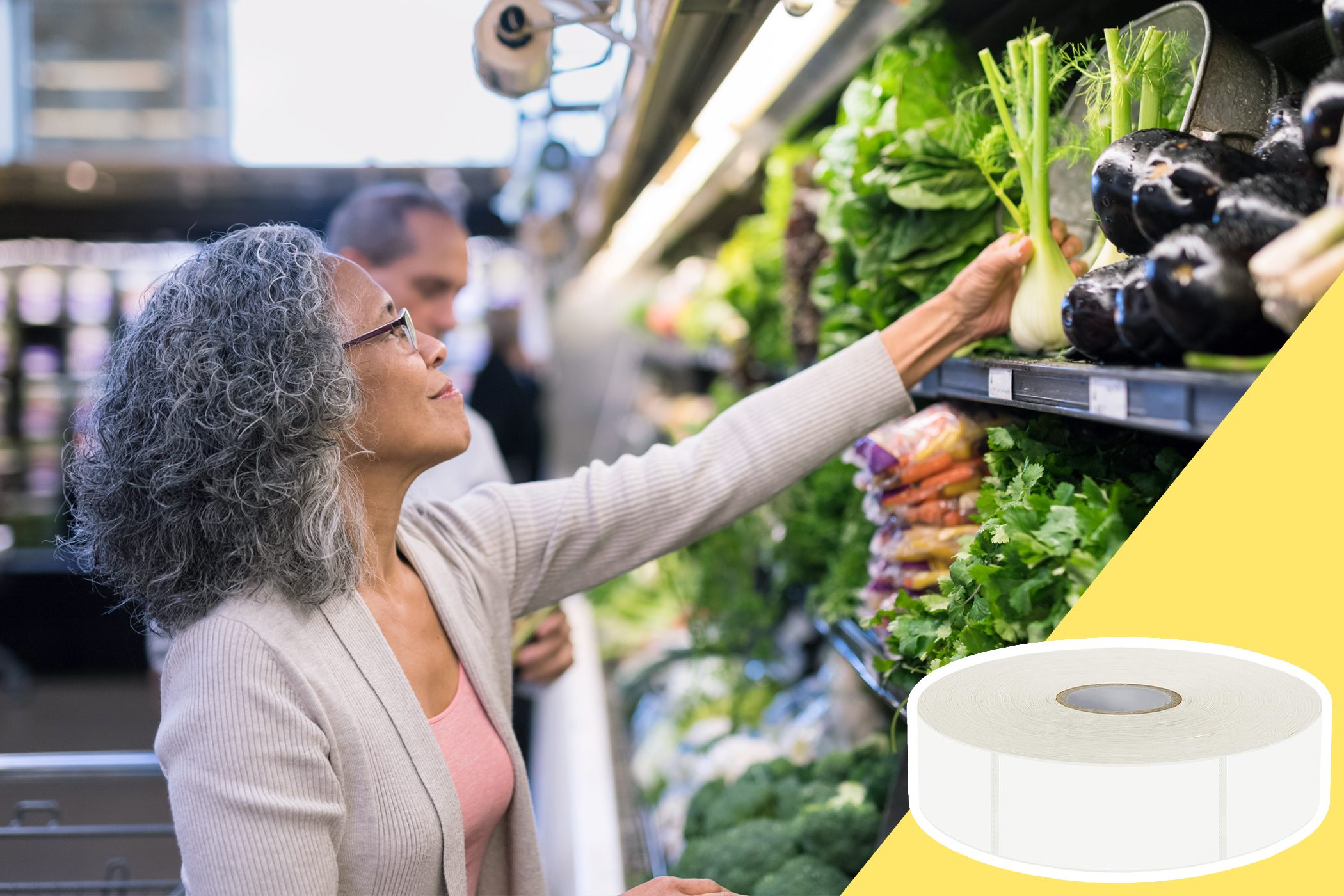 Woman selecting fennel in a grocery store produce aisle; surrounded by vegetables and packaged goods.