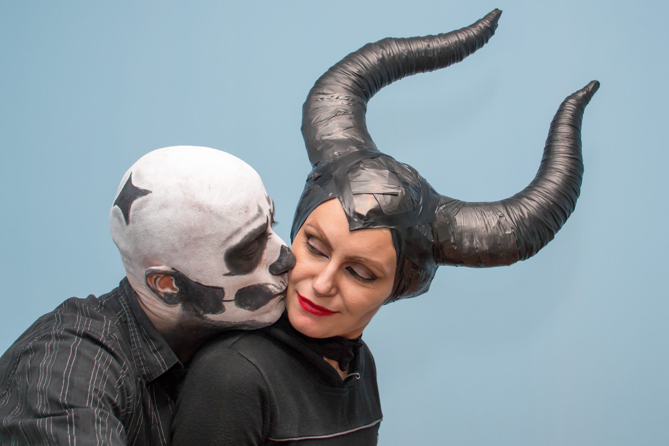 Couple in Halloween costumes and makeup 