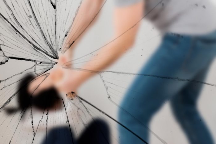 domestic violence, abuse and people concept - man beating helpless woman at home
