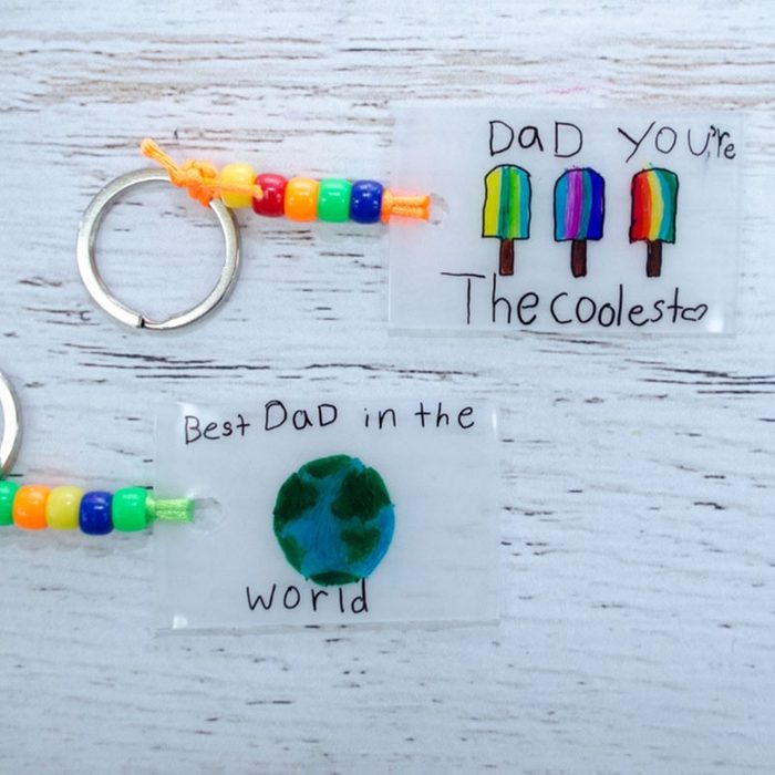 Keychains feature colorful beads and decorated tags. One reads, 