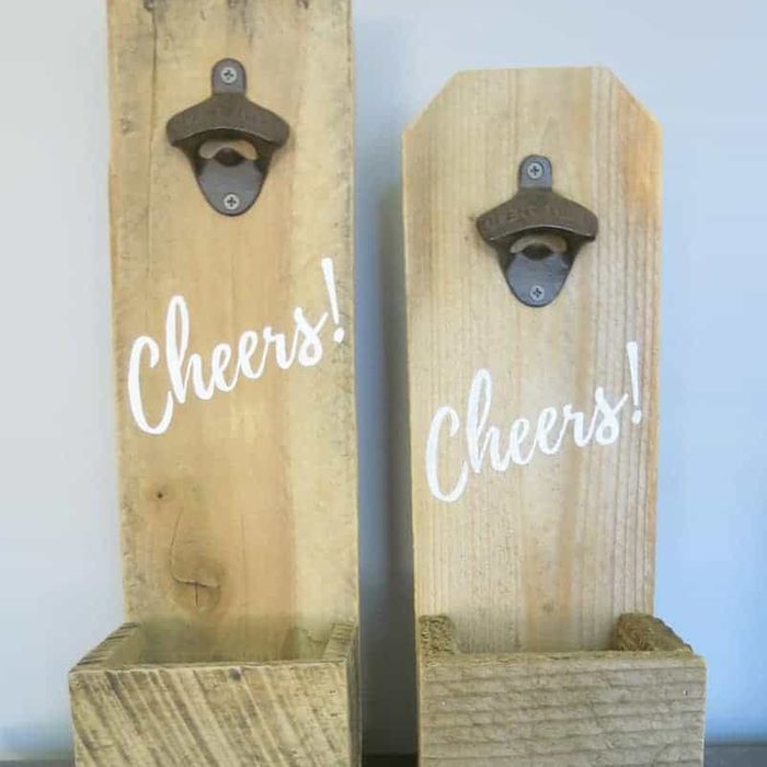 Two wooden bottle openers mounted vertically, printed with 