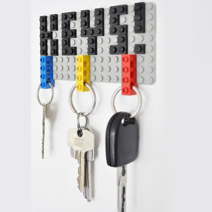 Keychain holder made from LEGO bricks holds keys. The word 