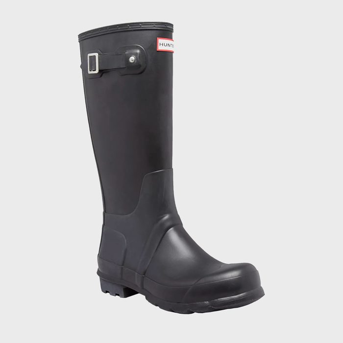 Black rubber boot stands upright with a metal buckle, set against a plain white background.