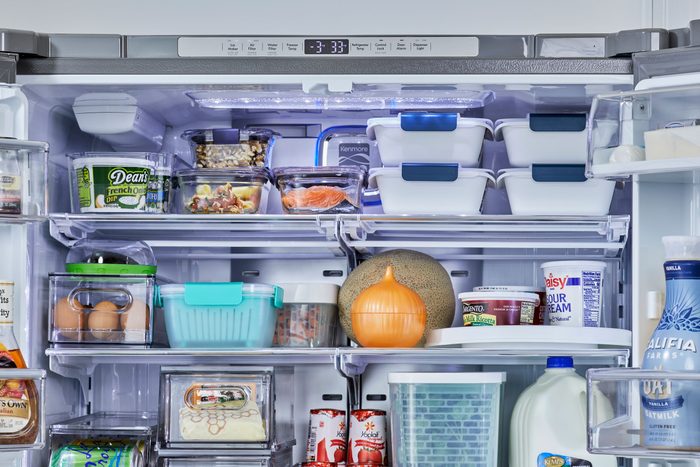 Refrigerator shelves hold various foods like eggs, containers, and fruits. Top panel reads "3:33." Items include ranch dip, milk, and sour cream.