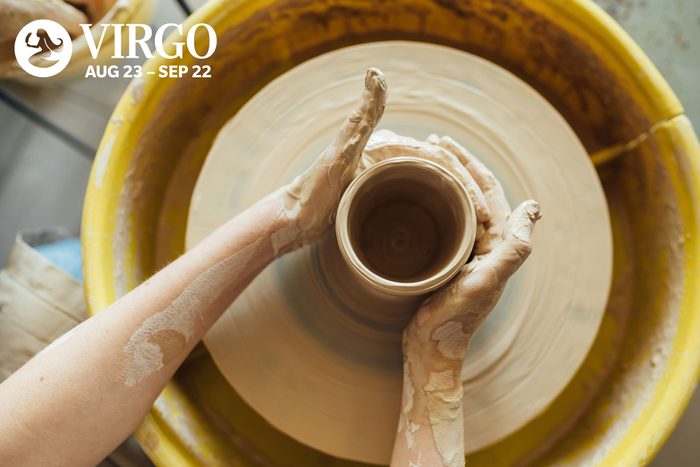 person making pottery