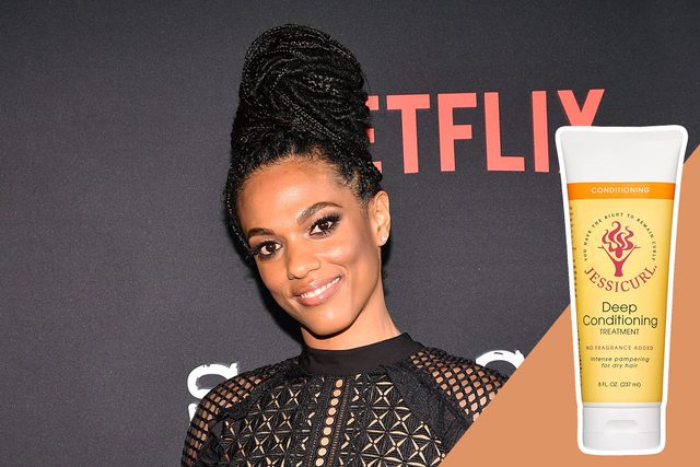 A person poses in front of a Netflix backdrop, wearing a lacy black outfit. A Jessicurl Deep Conditioning Treatment bottle is shown beside them.