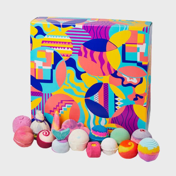 Colorful box displaying vibrant bath bombs arranged neatly, set against a plain white background.
