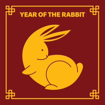 Yellow rabbit silhouette is sitting; surrounded by decorative border. Text reads: â€œYear of the Rabbit.â€ Background is dark red.