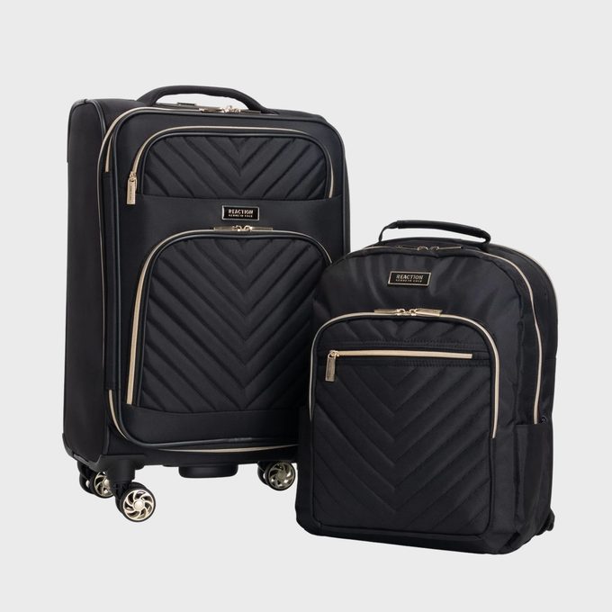 Luggage set resting; featuring a wheeled suitcase and backpack with quilted patterns; set against a plain white background.
