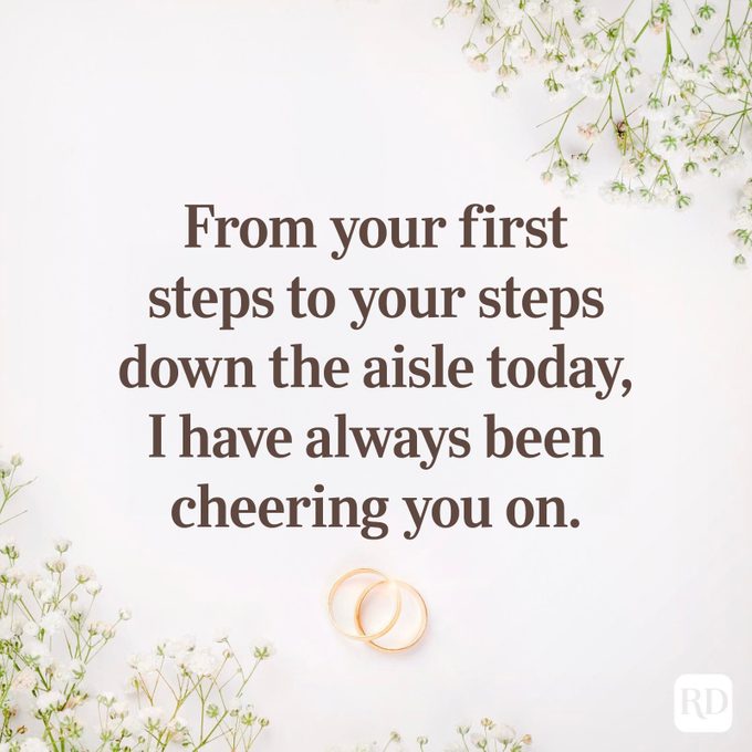 Text expresses support, surrounded by delicate white flowers and two gold rings on a light background.