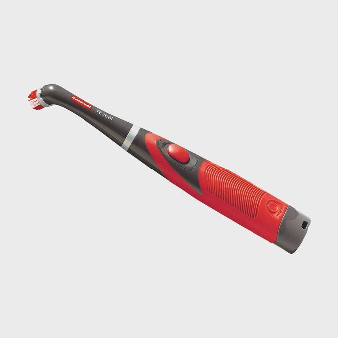 Toothbrush lying flat, featuring a red and gray handle with 