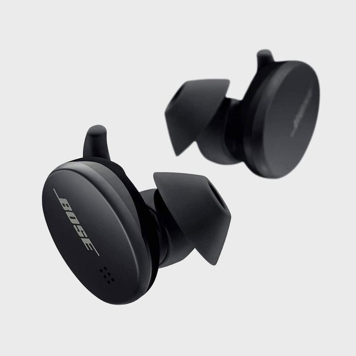 Earbuds rest against a light background, featuring 