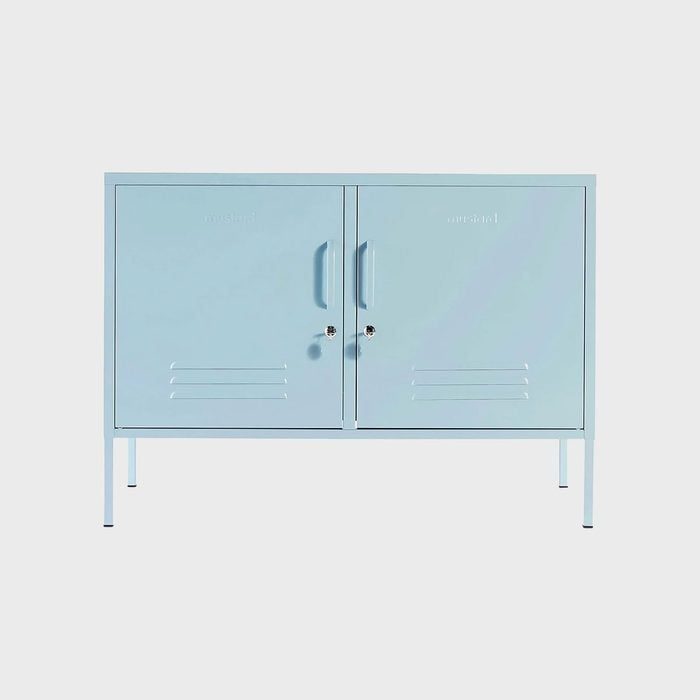 Light blue metal cabinet with two doors stands on four legs, against a plain background. Text on doors reads 