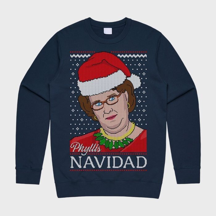 Sweater featuring a person in a Santa hat, surrounded by snowflakes, with text 