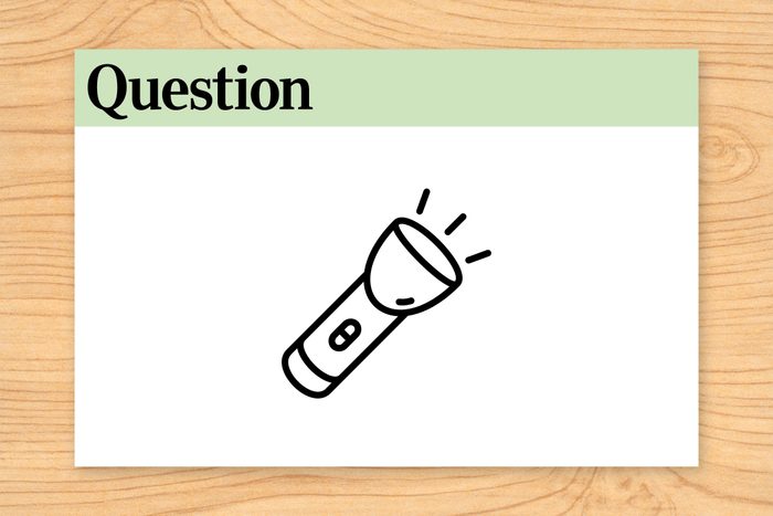 Flashlight emits light, displayed on a question card labeled "Question 3" with a wooden background.