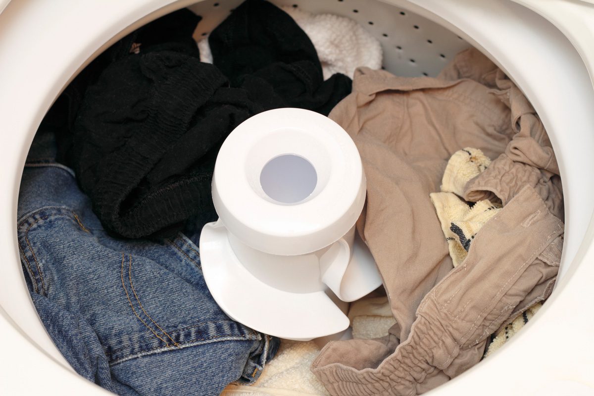 clothes inside traditional washer with agitator
