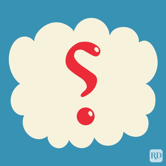 Irony Mark in the color red on a beige cloud on blue background.